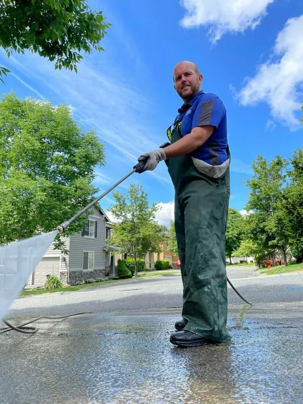 Pressure washing a driveway